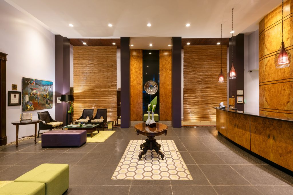 The stylish and contemporary hotel lobby and reception area, featuring clean lines, modern furniture, and a professional front desk.
