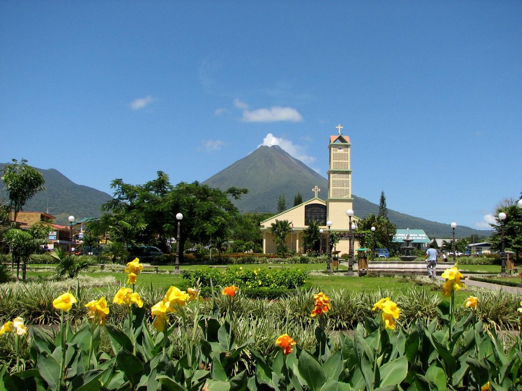 Iconic view of Arenal Volcano and La Fortuna Church in Costa Rica - A signature destination highlight by Horizontes Nature Experiences